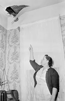 Alabama Prints: Hewlett Hodges Pointing to Hole in Ceiling