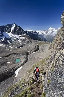 Images Dated 9th July 2011: Hiker ascending Mt Tschenglser Hochwand or Croda di Cengles over the via ferrata