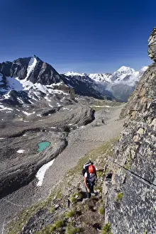 Eastern Alps Prints: Hiker ascending Mt Tschenglser Hochwand or Croda di Cengles over the via ferrata