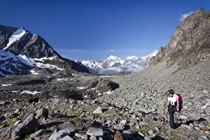 Province Of South Tyrol Prints: Hiker during ascent of Mt Tschenglser Hochwand above Duesseldorfer Huette hut in Sulden