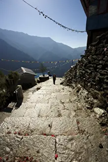 Actions Prints: Hiker climbing shiny stone steps against a blue sky