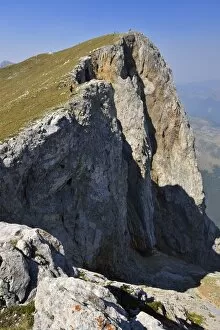 Hiker on the summit of Kom Vasojevicki Mountain, 2461 m, Komovi Mountains, Montenegro, Crna Gora, The Balkans, Europe