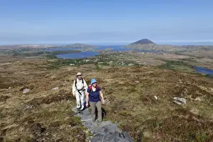 Actions Prints: Hikers climbing to Diamond Hill