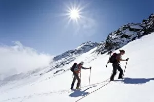 Hikers on Weissbrunnferner Mountain during the ascent to Hinterer Eggenspitz Mountain in the Val dUltimo