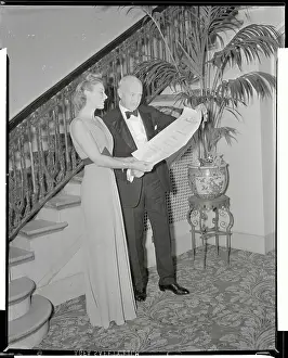 Hildegarde and Frank Crowninshield Looking at Award