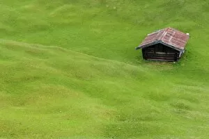 Hilly meadow with hay barn at Mt. Kranzberg, Karwendelgebirge mountains, Mittenwald, Werdenfelser Land area