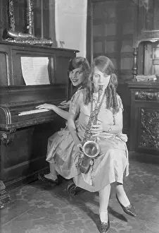 Hilton Siamese Sisters Playing Musical Instruments