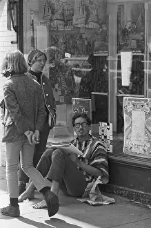 Storefront Prints: Hippie Studying on Sidewalk