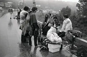 Hippies Sitting Beside Highway in the Rain