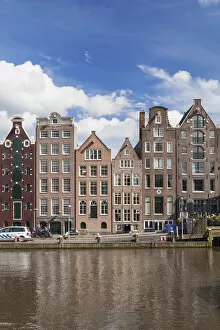 Dutch Gallery: Historic buildings along the Damrak canal in Amsterdam, Holland, Netherlands, Europe