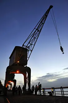 Promenade Prints: Historic loading crane, renovated port facility of Estacao das Docas with the promenade