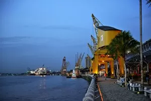 Historic loading cranes, renovated port facility of Estacao das Docas with the promenade, restaurants and shops, Belem