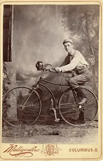 Time Captured: Vintage Art: Historical cabinet card portrait of teenage boy on bike in studio
