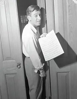 Hoagy Carmichael Holding a Sheet of Music