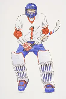 Ball Games Prints: Hockey goalkeeper wearing helmet and knee pads holding a hockey stick, front view