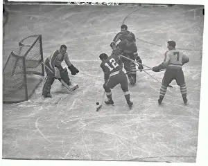Prints of (Original Caption) Frozen Moments: A Journey Through Hockey History: Hockey Players in Action