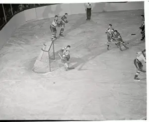 Prints of (Original Caption). This hockey goal tending is a cinch to judge by this pose of Goalie Frank Brimsek of the Boston Bruins Frozen Moments: A Journey Through Hockey History: Hockey Players in Action