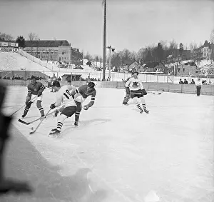 Prints of (Original Caption) 2/4/1932-Lake Placid, NY- FIGHT FOR THE PUCK... IN WINTER OLYMPIAD Frozen Moments: A Journey Through Hockey History: Hockey Players Battle for Puck