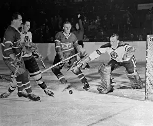Hockey Players Competing for the Puck