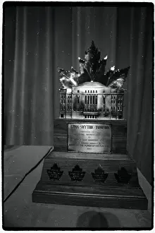 Prints of Photo shows the Connie Smyth Hockey Trophy Frozen Moments: A Journey Through Hockey History: Hockey Trophy Standing on Table
