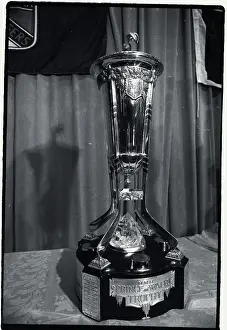 Prints of Photo shows the Prince of Wales Hockey Trophy Frozen Moments: A Journey Through Hockey History: Hockey Trophy Standing on Table