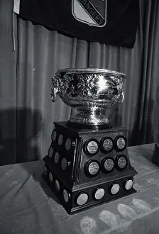 Prints of Photo shows the Art Ross Hockey Trophy Frozen Moments: A Journey Through Hockey History: Hockey Trophy Standing on Table