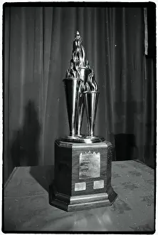 Prints of Photo shows the William Masterson Hockey Trophy Frozen Moments: A Journey Through Hockey History: Hockey Trophy Standing on Table