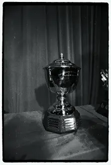 Prints of Photo shows the James Norris Hockey Trophy Frozen Moments: A Journey Through Hockey History: Hockey Trophy Standing on Table