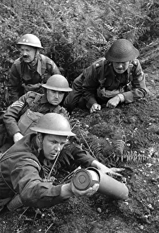 Prints of British Army soldiers in training with a cheaply-produced mortar cannon. Original Publication: Picture Post - 812 - We Make Our Own Mortar For 38/6 - pub. 1941 (Photo by Haywood Magee/Getty Images) Discover the Vision of Haywood Magee – A Master of Mid-Century British Life: Home-Made Mortar