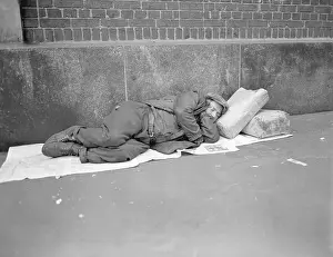 Homeless Man Sleeping on Street