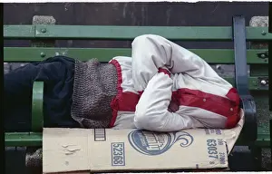 Homeless Person Sleeping on Bench