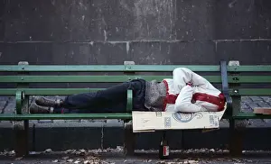Homeless Person Sleeping on Bench