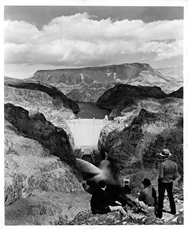 Prints of A view as two men take in the view of Boulder Dam, renamed Hoover Dam in Nevada, Arizona boarder. Circa 1950. (Photo by Pictorial Parade/Archive Photos/Getty Images) A Timeless Collection of Hoover Dam Photography: HOOVER DAM
