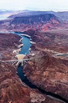 Prints of An aerial shot of the Hoover Dam and Lake Mead.Hoover Dam, is a concrete arch-gravity dam in the Black Canyon of the Colorado River, on the border between the U.S. states of Arizona and Nevada A Timeless Collection of Hoover Dam Photography: Hoover Dam Aerial