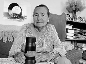 Prints of BOULDER CITY, NEVADA - SEPTEMBER 23: Boulder City resident Erma Godbey at home with a 13 lb pin used in Hoover Dams construction, September 23, 1985 in Boulder City, Nevada A Timeless Collection of Hoover Dam Photography: Hoover Dam resident Erma Godbey