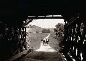 Horse and Buggy Viewed Through Covered Bridge