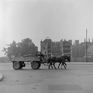 Horse Driven Vehicle Going by War Torn Scene