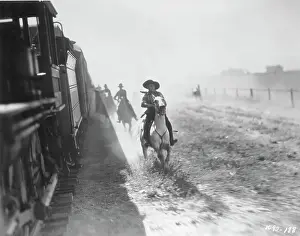 Horsemen Chasing Train