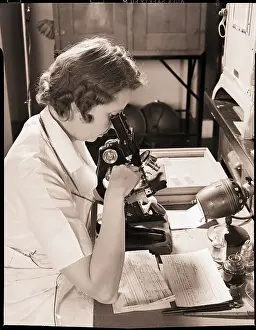 Technician Prints: Hospital Technician Examining Slide