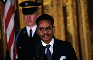 Hossain Muhammad Ershad Speaking into Microphones
