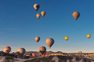 Hot air balloon over cappadocia rock landscape