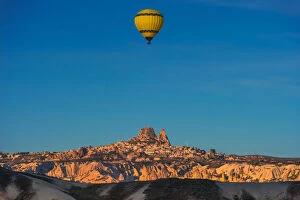 Images Dated 13th April 2013: Hot air balloon over cappadocia rock landscape