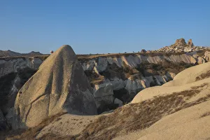Images Dated 22nd September 2015: Hot air balloon flying over rock landscape at Cappadocia Turkey