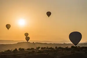 Levitation Prints: Hot air balloon flying over rock landscape at Cappadocia Turkey