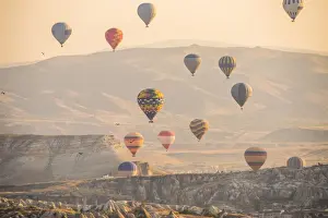 Levitation Prints: Hot air balloon flying over rock landscape at Cappadocia Turkey