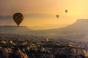 hot air balloons over cappadocia landscape