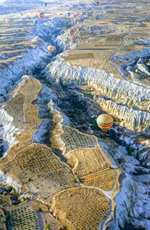 Hot air balloons above a gorgeous landscape of Cappadocia in Turkey