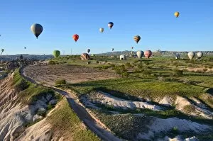 Images Dated 7th May 2015: Hot Air Balloons landing on a field in Cappadocia