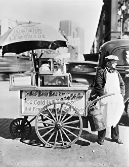 Merchant Prints: Hot Dog Vendor Standing Beside Cart