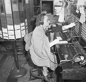Hotel Switchboard Operator in Coat and Gloves